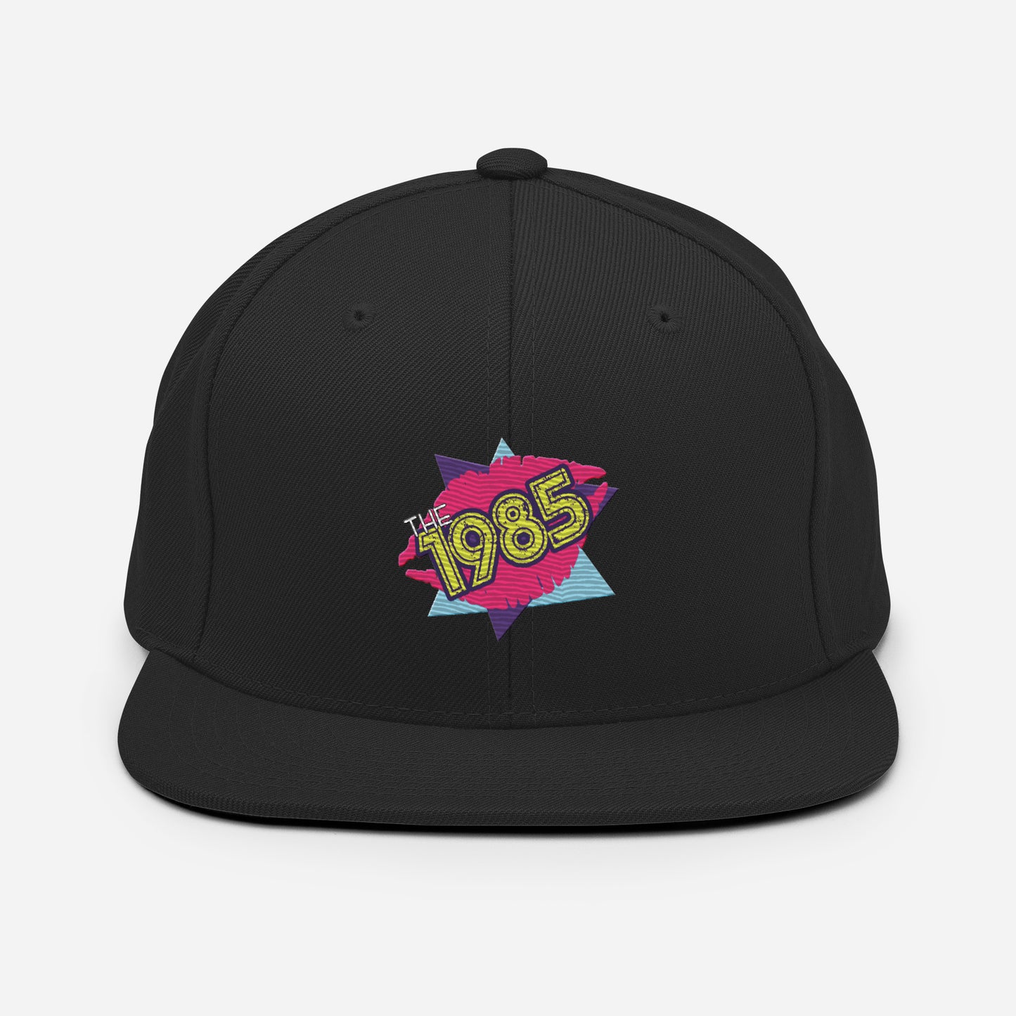 The 1985 Embroidered Logo Snapback Hat