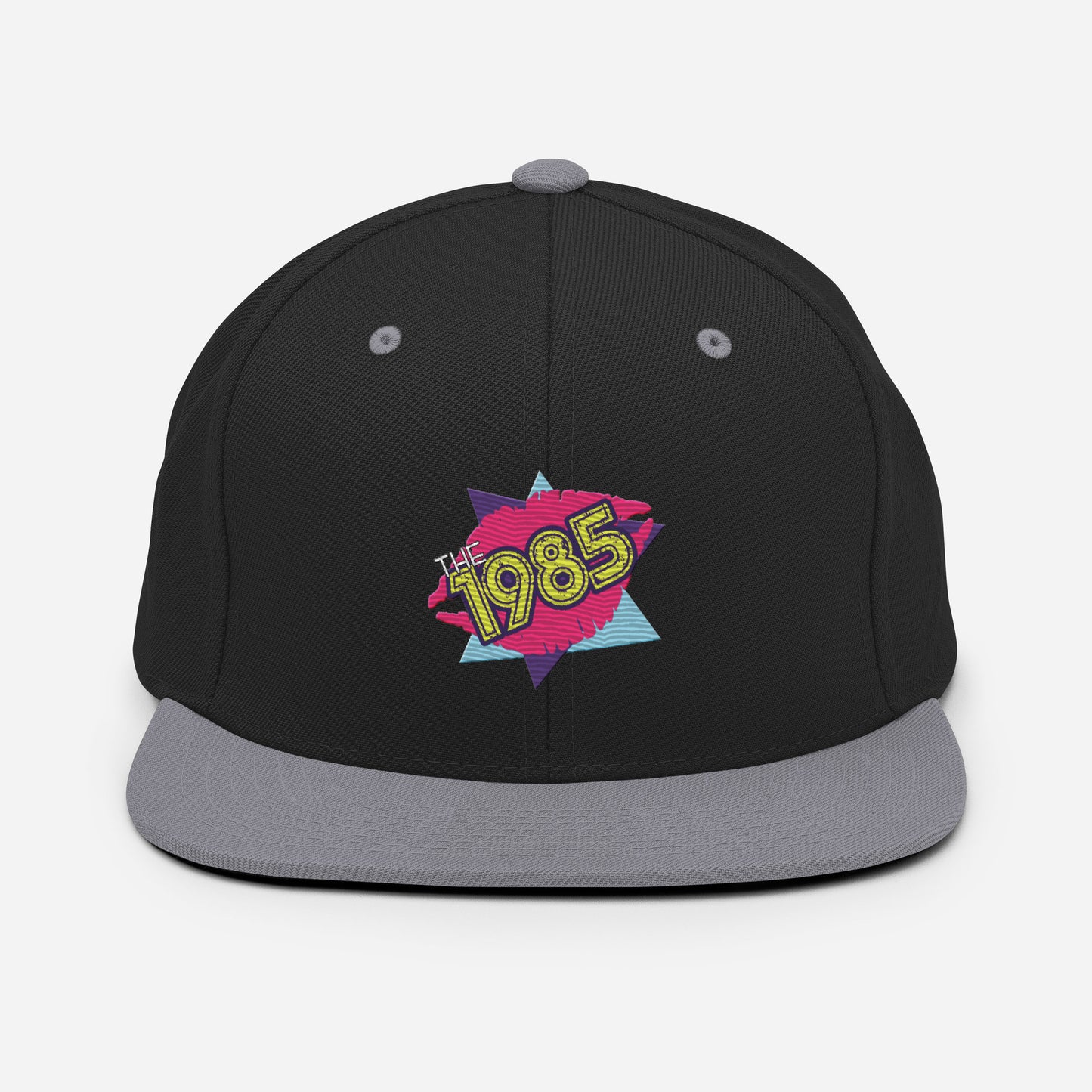 The 1985 Embroidered Logo Snapback Hat