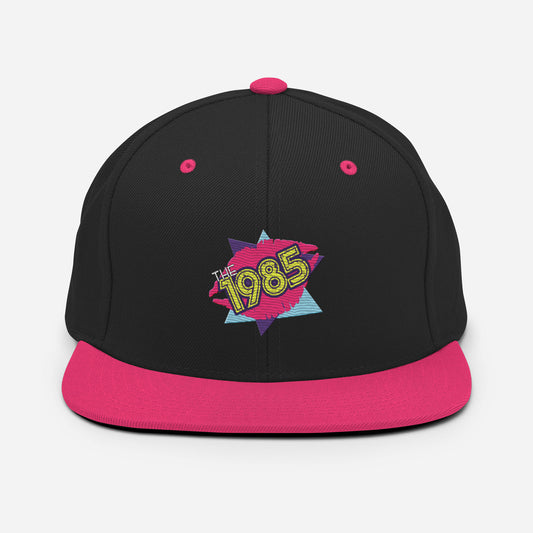 The 1985 Embroidered Logo Snapback Hat