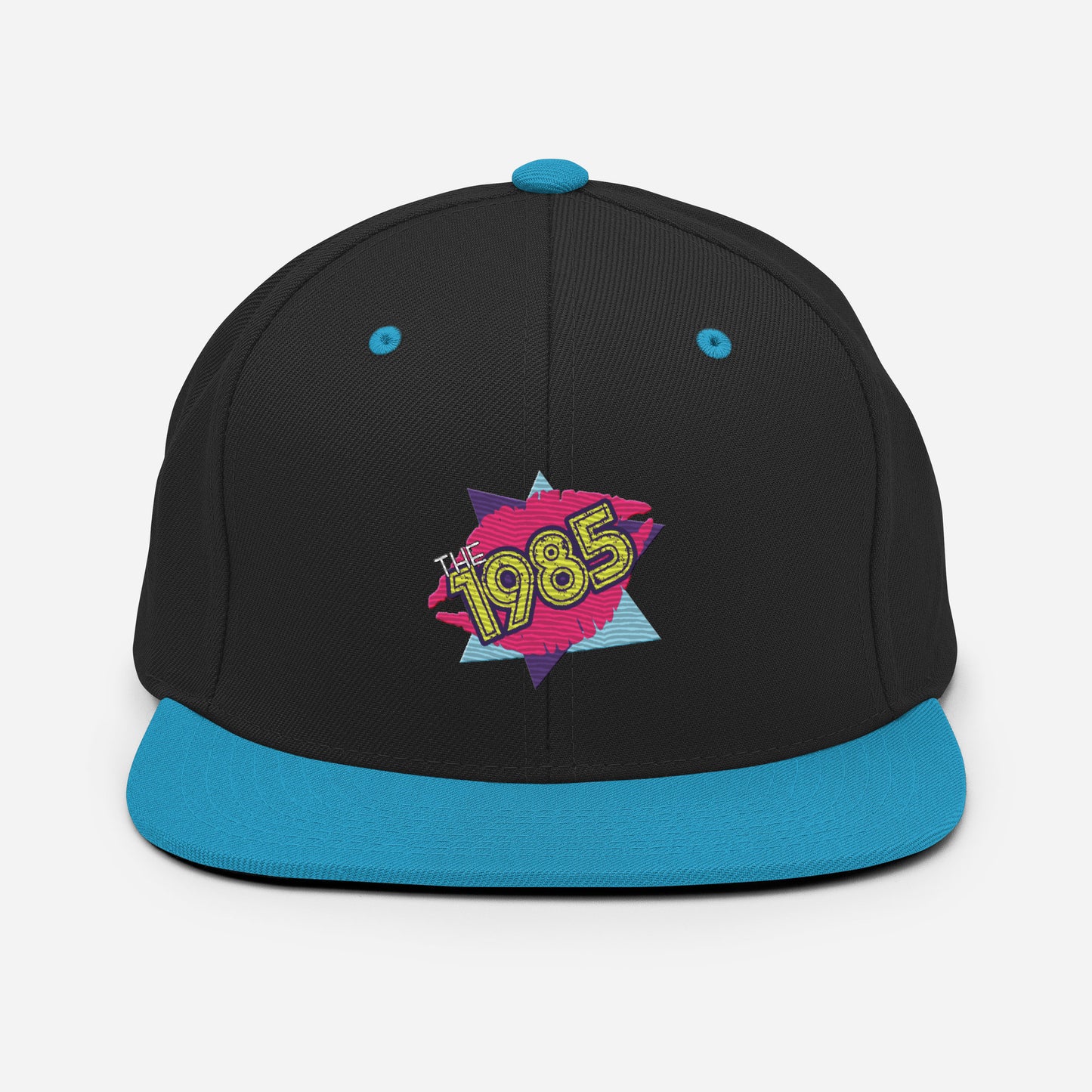 The 1985 Embroidered Logo Snapback Hat